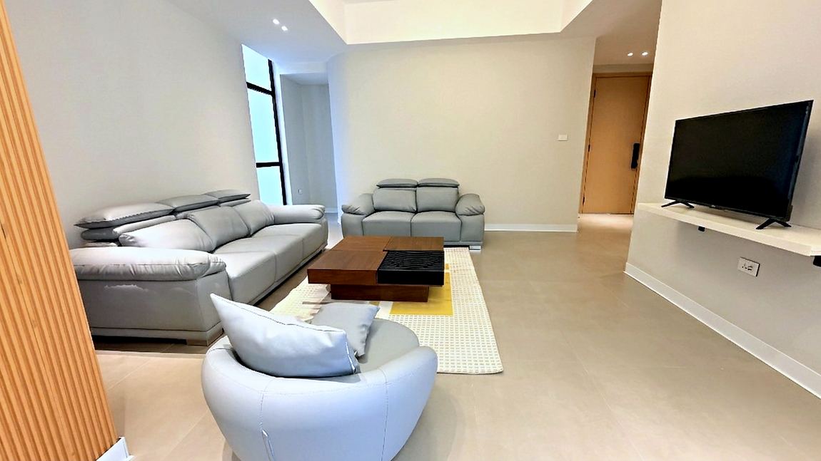 Living room with leather seating and a timber coffee table