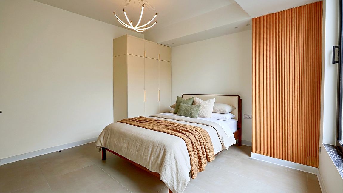 Bedroom with full height fitted wardrobes